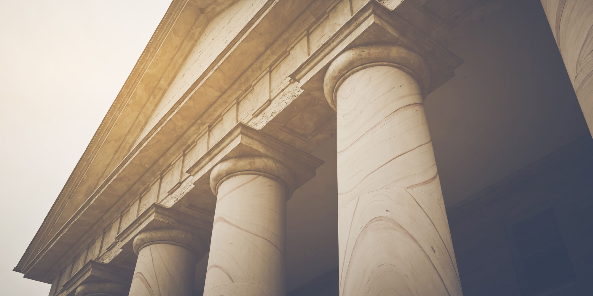 An old style university building's pillars 