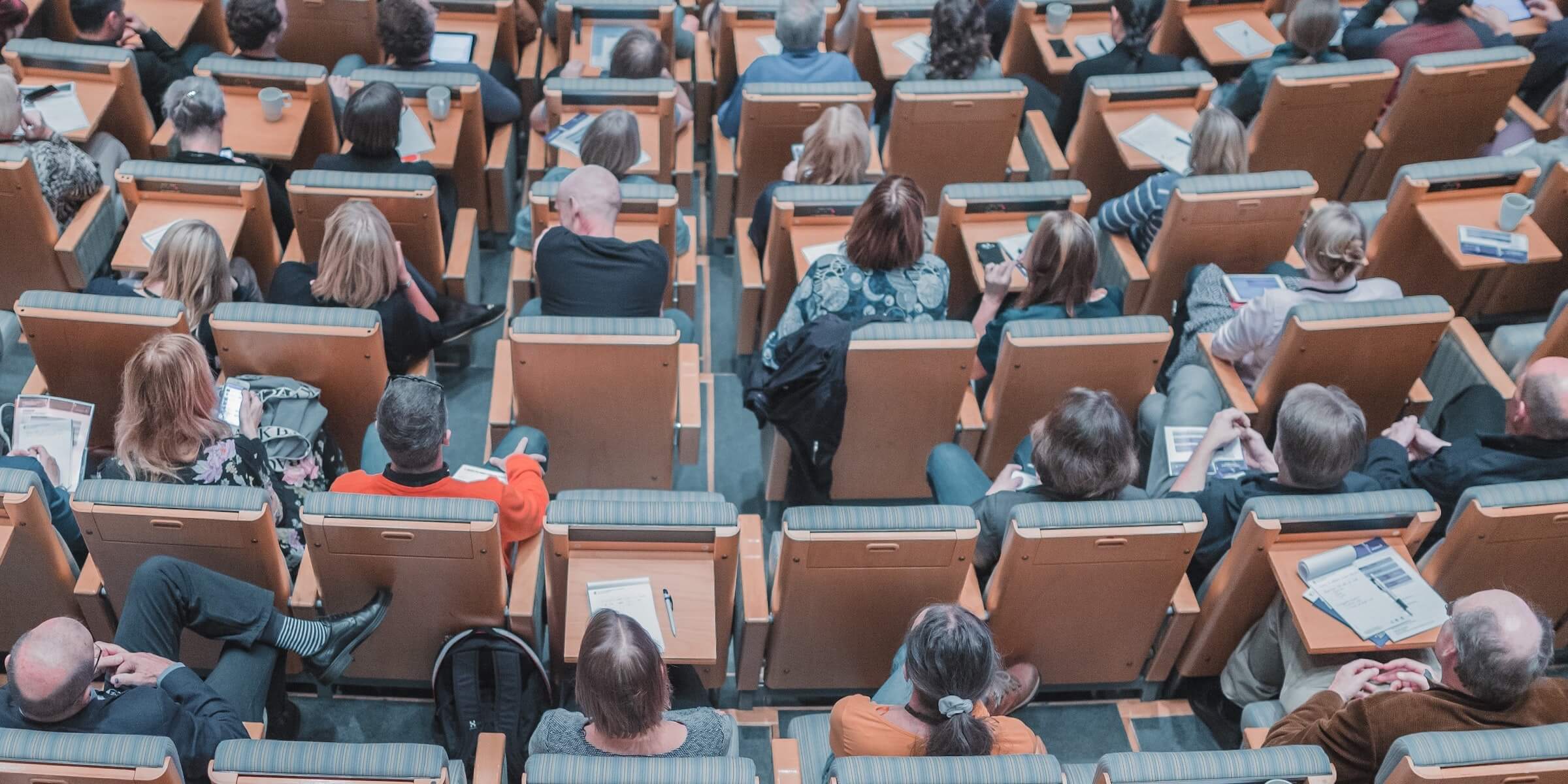 a lecture hall full of seated students