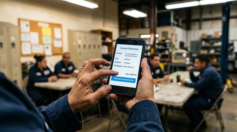 Adult learner completing a non-credit course registration on a smartphone during a work break.